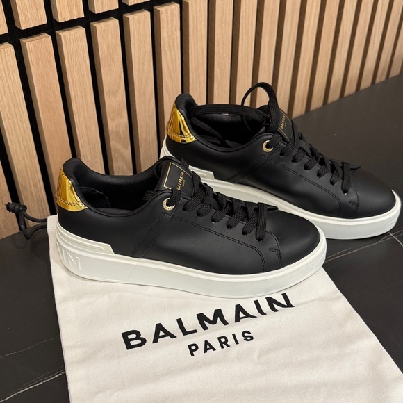 Balmain Shoes - Balmain Black and Gold Accent Sneakers B-Court Flip sneakers in calfskin